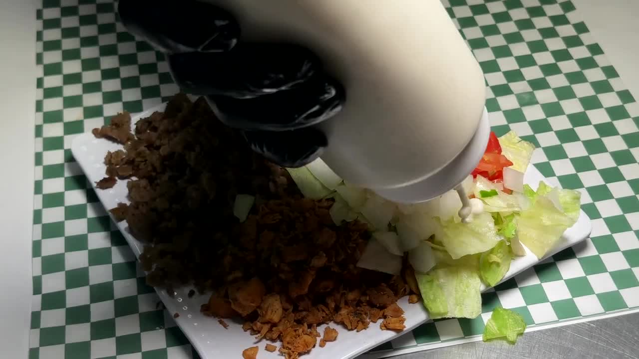 White sauce being added to the platter